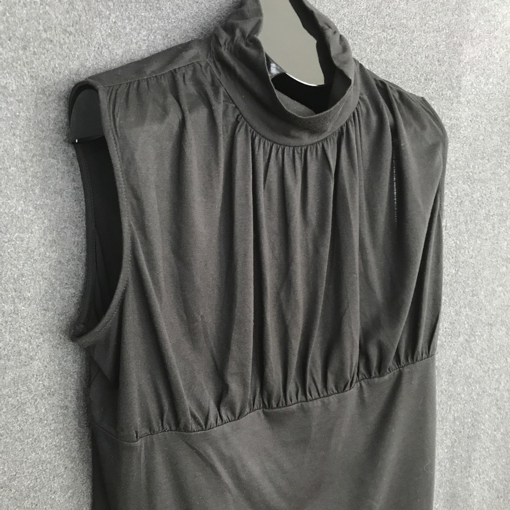 Sleeveless black turtleneck